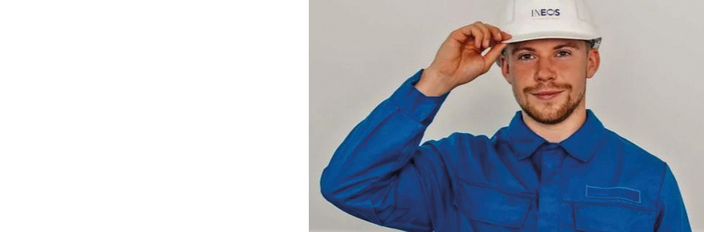 Junger Mann in Arbeitskleidung und Helm auf dem Kopf Junger Mann in Arbeitskleidung und Helm auf dem Kopf